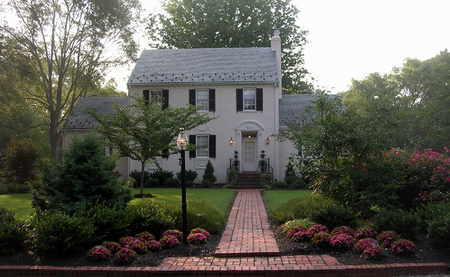 Emphasis on the approach to the front door updates this property.