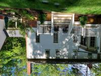 After: One door, one set of steps off the deck, brick retaining walls, and garden. 