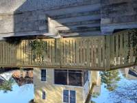 Retaining wall and parking area off the alley with rear entry with 
bluestone step treads.