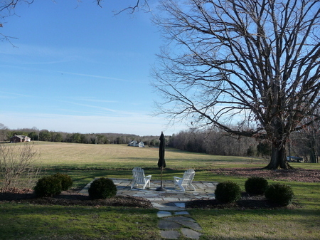 This dry laid stone patio was sited to enjoy the view and planted with boxwoods for simplicity and form.