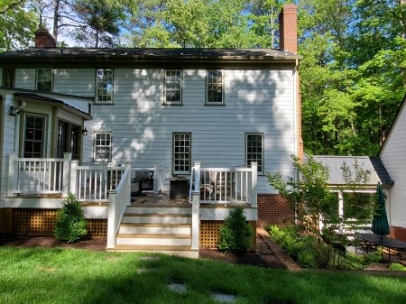 After: One door, one set of steps off the deck, brick retaining walls, and garden. 