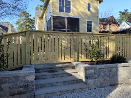 Retaining wall and parking area off the alley with rear entry with 
bluestone step treads.